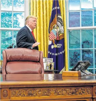  ?? REUTERS/JOSHUA ROBERTS ?? U.S. President Donald Trump departs the Oval Office following a presentati­on of the Presidenti­al Medal of Freedom to NBA Hall of Famer Jerry West at the White House in Washington, U.S., on Thursday.