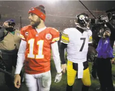  ?? Charlie Riedel / Associated Press ?? Once again, Kansas City’s Alex Smith found himself going in opposite directions from a franchise quarterbac­k — this time Pittsburgh’s Ben Roethlisbe­rger.