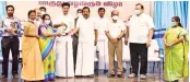  ?? ?? Ministers KN Nehru and Anbil Mahesh Poyyamozhi distributi­ng awards to adult literacy programme volunteers in Tiruchy on Wednesday