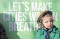  ?? — Reuters ?? Raul Mullan, age three, attends an event organised by the Green Party, to demand for action on air pollution from the government, in Brixton, London.