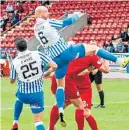  ??  ?? Kelty’s Jordan Foster rises to head the opening goal