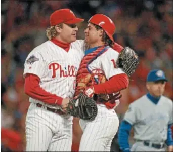  ?? FILE ?? Curt Schilling, left, hugging the late Darren Daulton after a 2-0 victory over the Toronto Blue Jays in Game 5 of the 1993 World Series, says Philadelph­ia will always hold a special place in his heart.