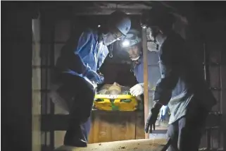  ??  ?? A JULY 9 photo shows a survivor being rescued from his house in the Mabicho district in Kurashiki, Okayama prefecture, some three days after flooding caused by rains devastated parts of Japan.