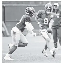  ?? Robert Sabo (2) ?? GOOD TO GO: Saquon Barkley, taking a handoff from Daniel Jones during practice Thursday, wouldn’t guarantee he would return Sunday against Arizona, but said he has “no doubt in my mind” when asked if his body is ready to play.