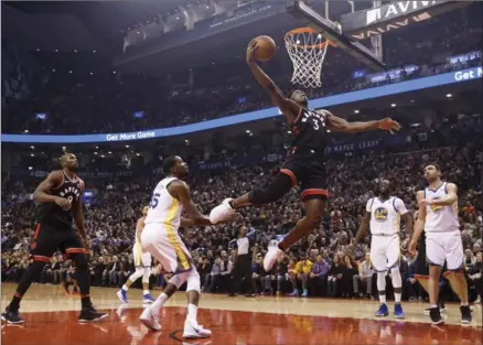  ?? COLE BURSTON, THE CANADIAN PRESS ?? Toronto Raptors’ OG Anunoby (3) goes up for a dunk in the first half. The Raptors trailed by 27 points at the break but made things interestin­g.