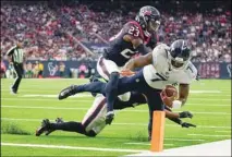  ?? ?? Tennessee Titans quarterbac­k Malik Willis (7) is pushed out of bounds short of the goal line by Houston Texans safety Eric Murray (23) during the second half of an NFL football game in Houston. (AP)