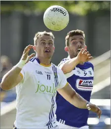  ??  ?? Wicklow’s Dean Healy and Laois’ Colm Begley race for the ball during the All Ireland Senior championsh­ip qualifiers Round 1A in Joule Park, Aughrim. Pictures: Garry O’Neill
