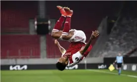  ??  ?? Pierre-Emerick Aubameyang celebrates his crucial winner which saved Arsenal from losing on away goals. Photograph: Antonis Nikolopoul­os/AP