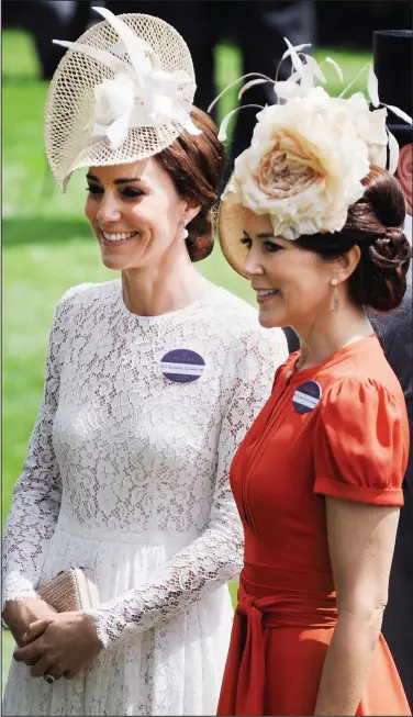  ??  ?? Strikingly similar: The Duchess of Cambridge and Princess Mary of Denmark at Ascot yesterday