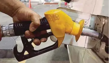  ?? FILE PIC ?? When motorists pay RM2.20 per litre at the petrol station, they are not considerin­g the hidden costs related to carbon emissions and climate change.