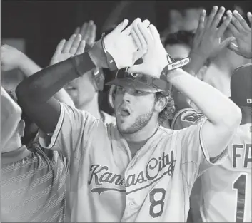  ?? Aaron Vincent Elkaim Associated Press ?? MIKE MOUSTAKAS is not playing in the All-Star game at Kansas City, but the young Royals third baseman feels he didn’t have numbers good enough to be selected and is working toward an All-Star future.