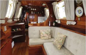  ??  ?? The boat’s interior – fitted out to the highest standard by Lennie Beauchamp, with oak flooring, and tongue and groove mahogany sides and Douglas fir roof.