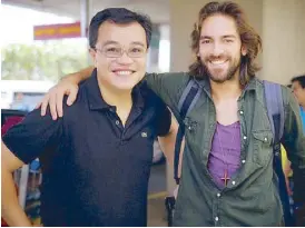  ??  ?? Director Paulo Dy with lead actor Andreas Muñoz