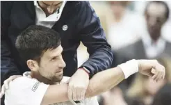  ??  ?? Novak Djokovic suffered his elbow injury during this year's Wimbledon quarter-final