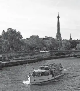  ?? ?? A general view the Eiffel Tower and the Seine river, as seen from Pont Alexandre III, is seen in 2022 in advance of the Paris 2024 Summer Olympic Games.
