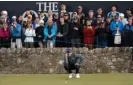  ?? Tom Jenkins/The Guardian ?? Rory McIlroy lines up a putt on the 17th green as fans watch on attentivel­y. Photograph: