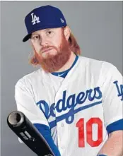  ?? Jamie Squire Getty Images ?? JUSTIN TURNER, THIRD BASE BACKUP Dodgers (Cal State Fullerton) Rejuvenate­d a stalled career when he joined Dodgers in 2014. Hit 27 home runs last season.