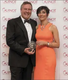  ??  ?? Anne Collins, owner of Mallow Beauty Rooms, being presented with the Guinot Crown Salon award which took place in London recently; pictured with Chris Gillham, MD of Guinot UK.
