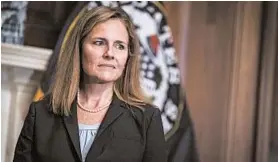  ?? SARAH SILBIGER/AP ?? Judge Amy Coney Barrett met with senators on Wednesday on Capitol Hill in Washington. Hearings for the Supreme Court nominee to replace Ruth Bader Ginsburg begin Oct. 12.