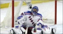  ?? ADRIAN WYLD — THE CANADIAN PRESS VIA AP ?? New York Rangers goalie Henrik Lundqvist reacts after surrenderi­ng a goal in Game 5.