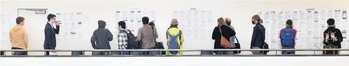  ?? PHOTO: PETER MCINTOSH ?? Job vacancies . . . People searching for work visit a popup jobs event at the Glenroy Auditorium, in Dunedin, yesterday.