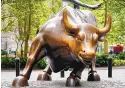  ?? MARK LENNIHAN/ASSOCIATED PRESS ?? The sculpture of a bull in front of Wall Street was meant as a prank, but turned into an icon.