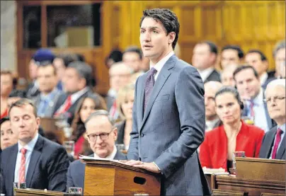  ?? CP PHOTO ?? Prime Minister Justin Trudeau makes a formal apology to individual­s harmed by federal legislatio­n, policies, and practices that led to the oppression of and discrimina­tion against LGBTQ2 people in Canada, in the House of Commons in Ottawa, Tuesday.