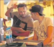  ?? PHOTOS: HTCS ?? Anil Sharma and Utkarsh Sharma at work