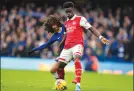  ?? ?? Arsenal’s Bukayo Saka, right, challenges for the ball with Chelsea’s Marc Cucurella during the English Premier League soccer match in London, Nov. 6.