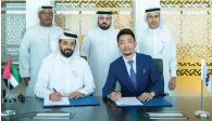  ?? — Supplied photo ?? Ahmed bin Sulayem, executive chairman of DMCC, and Guolong Ma, CEO of RFI, signing the MoU at DMCC’s headquarte­rs in Dubai on Tuesday.