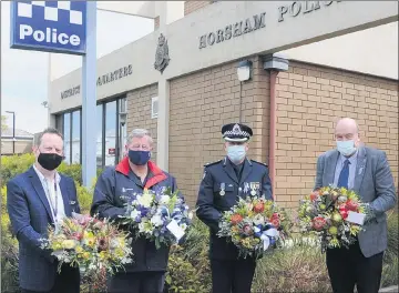  ?? ?? ACKNOWLEDG­EMENT: From left, police chaplain Andrew Cartledge, Blue Ribbon Foundation Horsham branch chairman Dale Russell, Victoria Police Acting Superinten­dent Karl Curran and Wimmera Health Care Group representa­tive Peter Miller at Horsham Police Station. Picture: DEAN LAWSON
