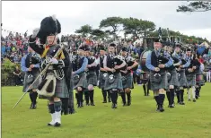  ??  ?? The popular parade of the Isle of Skye Pipe Band.