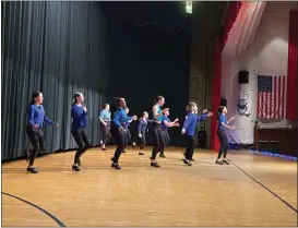  ?? FRANK MECHAM — THE NEWS-HERALD. ?? Tap dancers perform during a showcase of The Cleveland Tap Dance Conservato­ry, part of Savelli’s Dance studio.