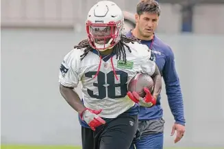  ?? Steven Senne/Associated Press ?? New England Patriots running back Rhamondre Stevenson performs a field drill during an offseason workout Tuesday in Foxborough, Massachuse­tts.