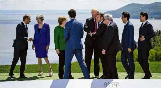  ?? Leon Neal/Getty Images/AFP ?? Líderes do G7 se reúnem para foto no primeiro dia do encontro que acontece no Canadá