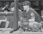  ??  ?? ANGELS Manager Mike Scioscia and second baseman Cliff Pennington watch from the dugout.