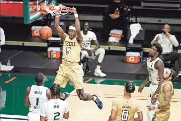  ?? AP-Lynne Sladky ?? Georgia Tech forward Moses Wright dunks during the first half of an NCAA college basketball game against Miami in Coral Gables, Fla., on Saturday.