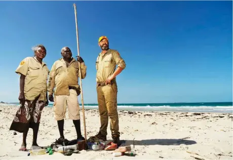  ??  ?? Yirralka rangers Djurambil Mununggurr (at left), Banul Munyarryun and Aaron Shorthouse assess a beach for marine debris in remote East Arnhem Land.