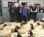  ?? Photograph: Kevin McGlynn ?? Judge of the Best Pen of Blackface Lambs, Iain Stewart is pictured with NFUS President Andrew McCornick, Morag, Donnie and Donald MacCorquod­ale sen being presented with the Jimmy Weir Memorial Trophy at Dalmally Market.