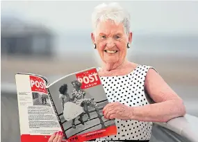  ??  ?? Pat, back in Blackpool last year, holding the iconic Picture Post magazine