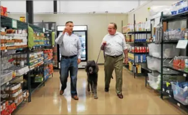  ?? SUBMITTED PHOTO ?? State Sen. Andy Dinniman, D-19, right, tours the new home of the West Chester Food Cupboard with Board President Joe Fratinardo.