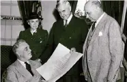  ?? Courtesy of Rice Woodson Research Center ?? President Franklin D. Roosevelt swears in Jesse H. Jones as U.S. Secretary of Commerce in 1940, shown with Mary Gibbs Jones and Stanley Forman Reed.