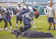  ?? SMILEY N. POOL/THE DALLAS MORNING NEWS VIA AP ?? Cowboys running back Ezekiel Elliott runs a drill during minicamp Wednesday in Frisco, Texas. Elliott is hoping to take on a greater leadership role with Dallas in the upcoming season.