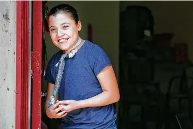  ?? Photos by Josie Norris / Staff photograph­er ?? Stephanie Mejia, 11, laughs as she stands at her family’s home. A student at SAISD’S Tafolla Middle School, she went months without required therapies or homebound classes because of a staff shortage and a paperwork error.