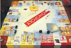  ?? PHOTO BY ANDY HOLZMAN ?? The artsy new “California Dreaming” Monopoly game board, with a canvas texture, was designed by Manhattan Beach-based artist Kathleen Keifer. The limited-edition version is on sale on Amazon for $199.