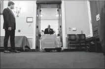  ?? ERIC THAYER / THE NEW YORK TIMES ?? A clerk rolls in a cart with copies of Present Donald Trump’s 2019 budget proposal Monday in the Capitol, where the House Budget Committee was to meet. Trump’s second federal spending plan again proposes steep cuts for the Environmen­tal Protection Agency, despite Congress’ rejection of a similar plan last year to dramatical­ly shrink the agency’s budget.