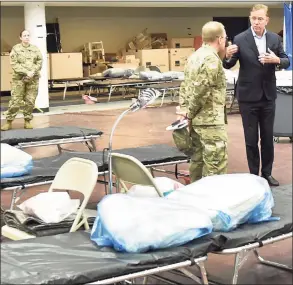  ?? Hearst Connecticu­t Media file photo ?? Gov. Ned Lamont, right, speaks with Army Maj. Gen Francis Evonas he tours a field hospital at Southern Connecticu­t State University in New Haven on April 1, 2020.