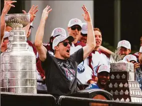  ?? Jack Dempsey / Associated Press ?? Colorado Avalanche defenseman Devon Toews cheers during a rally for the Stanley Cup champions Thursday in Denver.