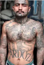  ??  ?? Tattooed terror: An MS-13 member