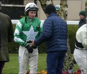  ??  ?? Jockey Seán O’Keeffe talking to trainer Paul Nolan after the second race.